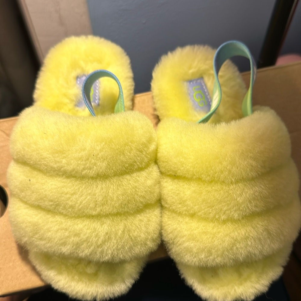 Kids yellow Ugg slides